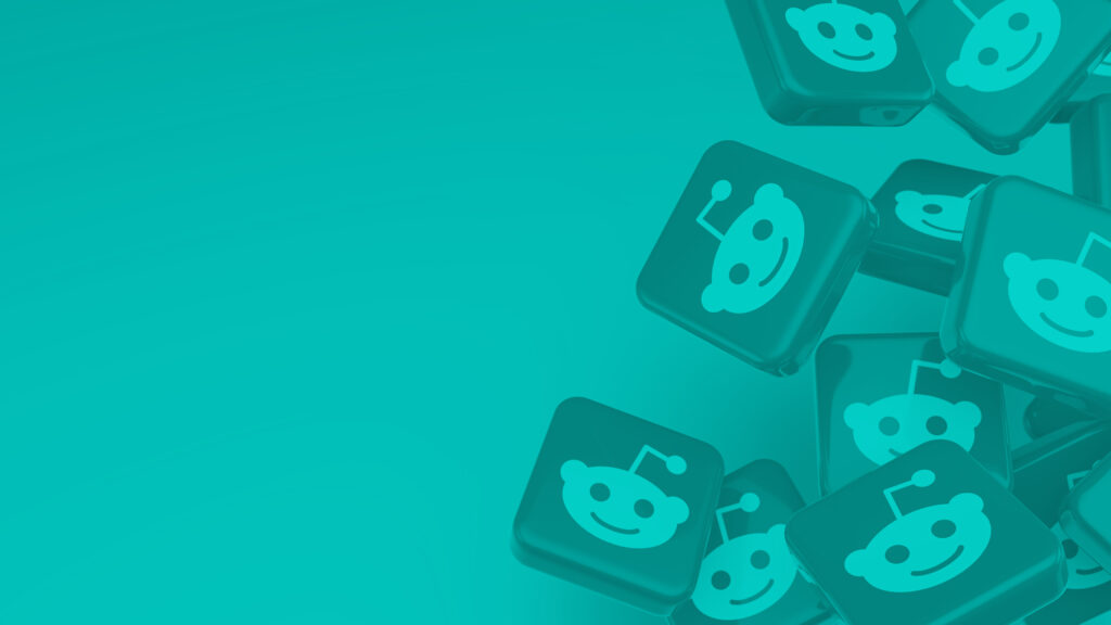 Blog feature image of a pile of falling 3D icons with the Reddit logo on them