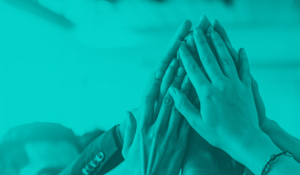 blog feature image of human hands raised up and touching representing company culture and teamwork
