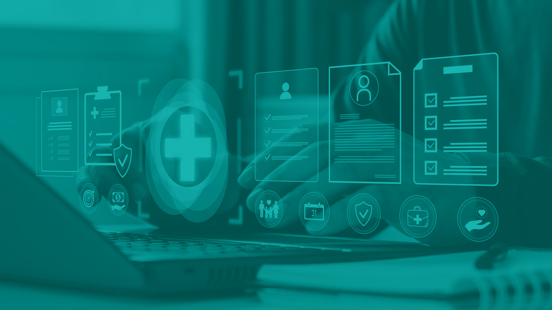Medical patient records concept. Male hands at a laptop keyboard with floating graphics hanging over showing a medical cross, and symbols for documents, and symbols for patients.